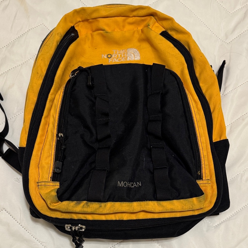 The North Face Yellow and Black Backpack with laptop sleeve